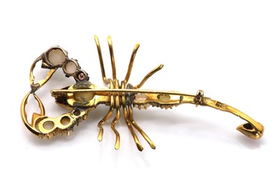 Lot 58 - A gold, opal and ruby scorpion brooch