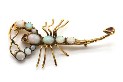 Lot 58 - A gold, opal and ruby scorpion brooch