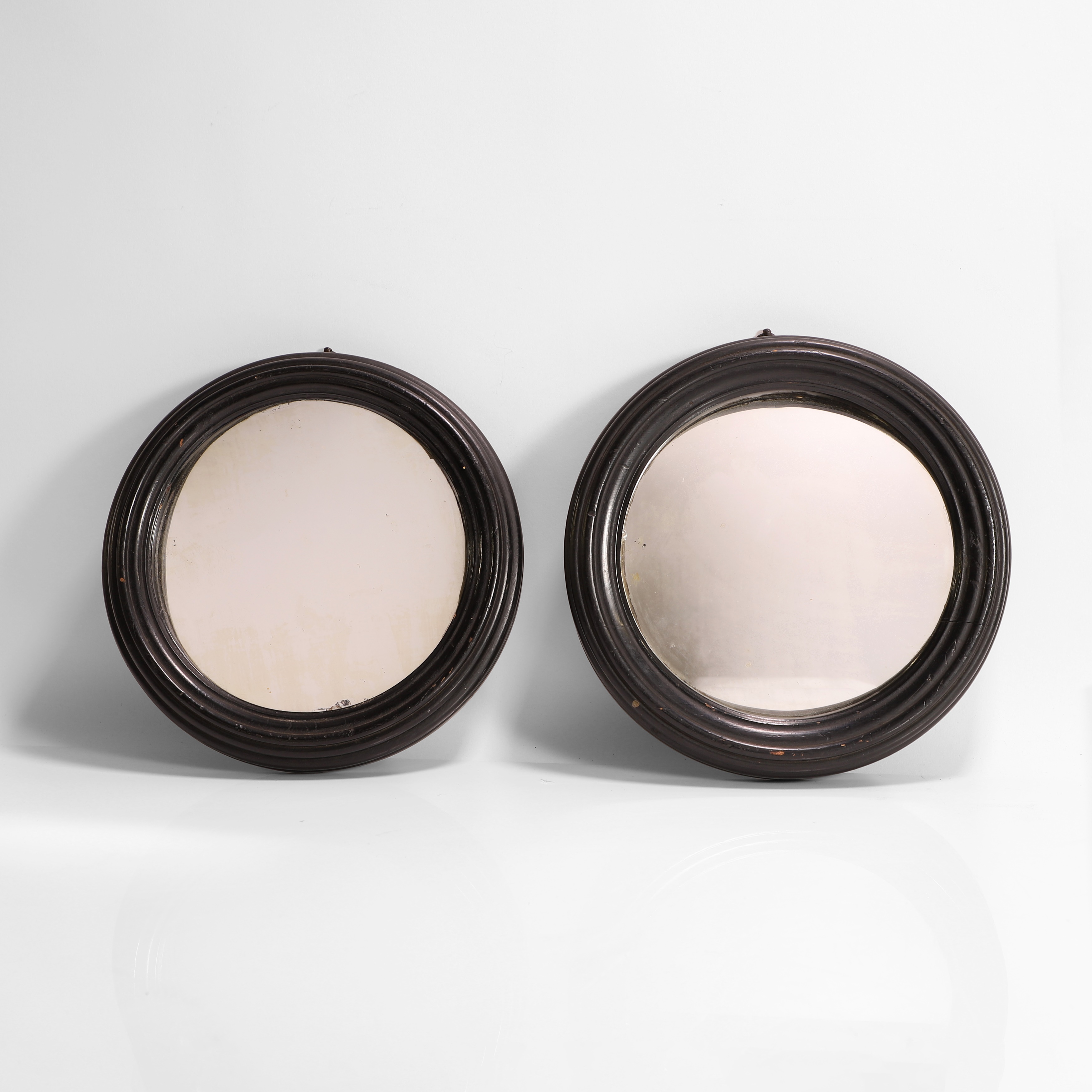 Lot 37 - A rare pair of circular distortion mirrors,