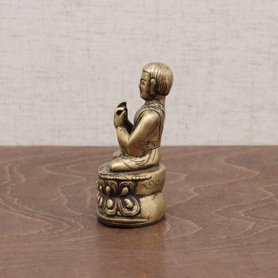 Lot 239 - A Tibetan bronze lama