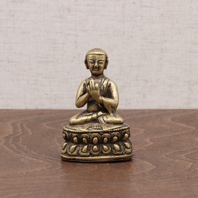 Lot 239 - A Tibetan bronze lama
