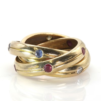 Lot 76 - A Cartier diamond, ruby and sapphire set Trinity ring