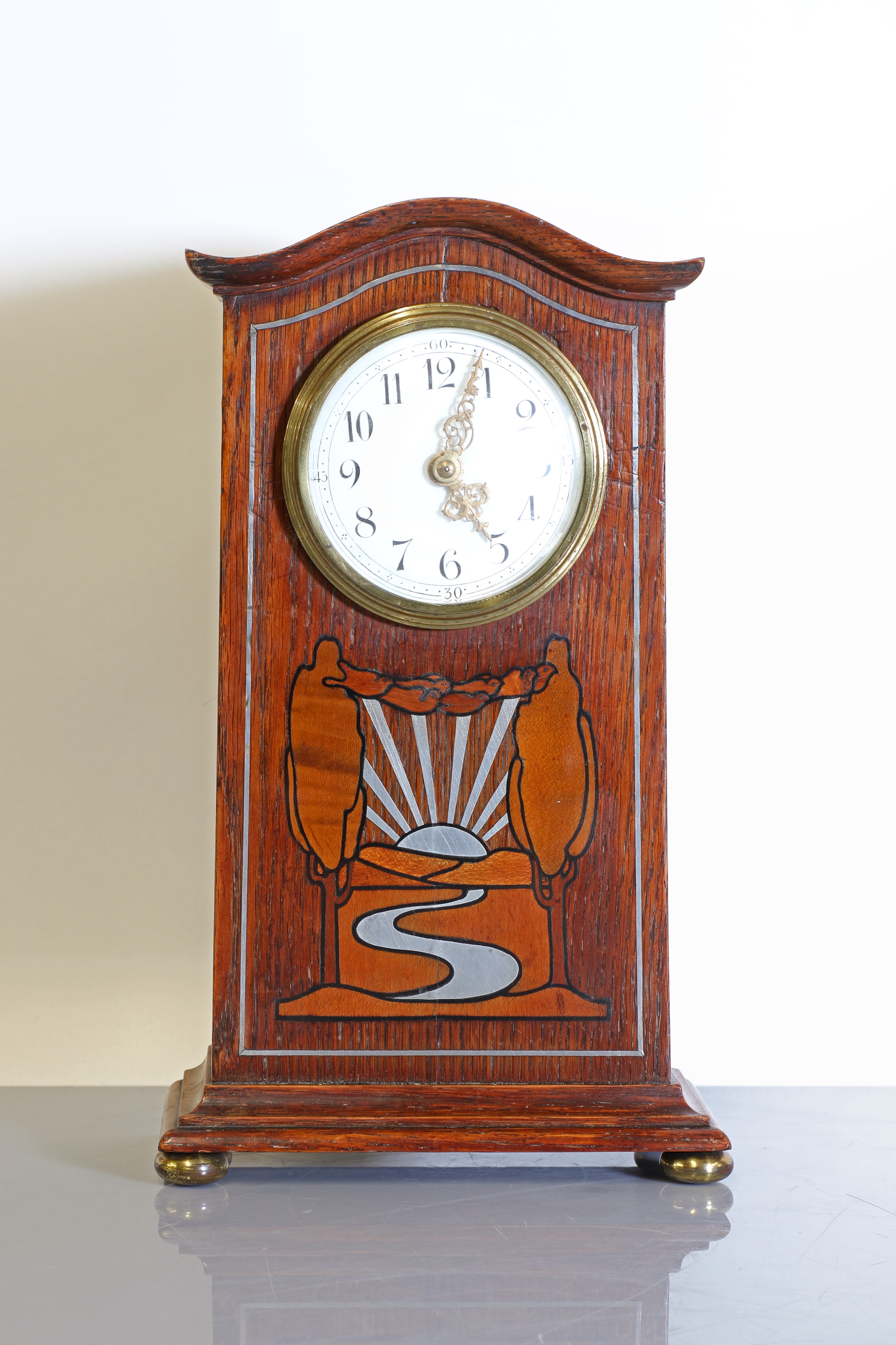 Lot 58 An oakinlaid and pewtermounted mantel clock,