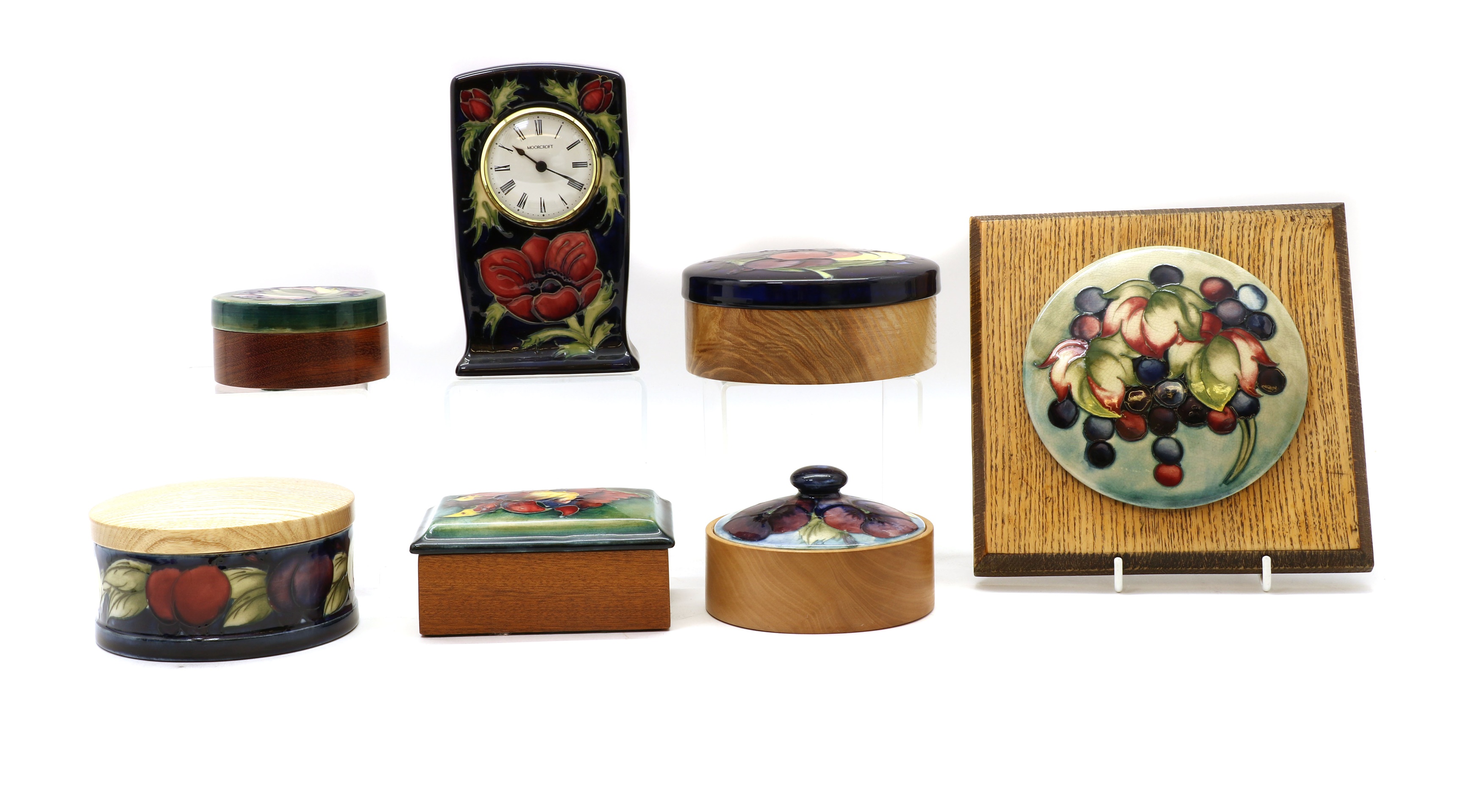 Lot 176 A collection of Moorcroft pottery boxes,