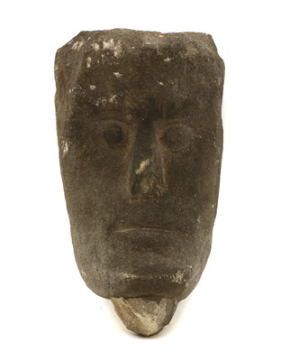 Lot 319A - A carved limestone head