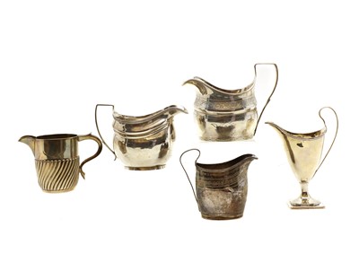 Lot 3 - A group of five silver cream jugs