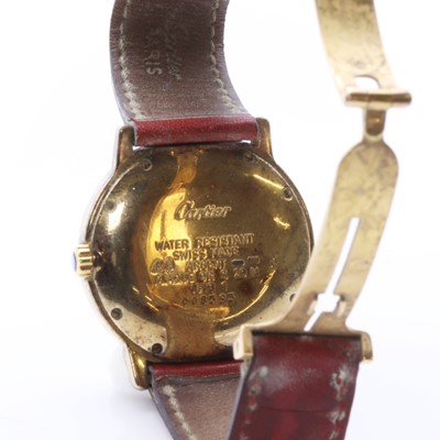 Lot 237 - A silver gilt Must de Cartier quartz strap watch