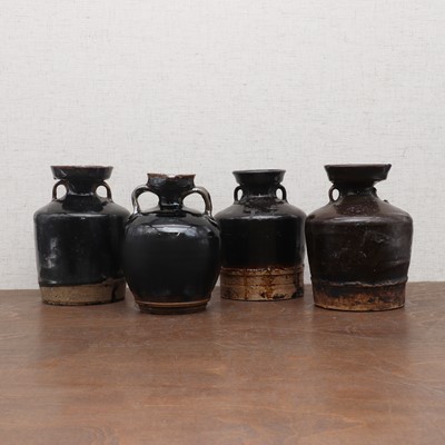 Lot 31 - A collection of four Chinese black-glazed jars
