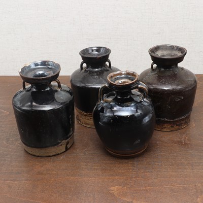 Lot 31 - A collection of four Chinese black-glazed jars