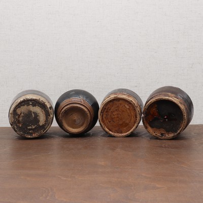 Lot 31 - A collection of four Chinese black-glazed jars