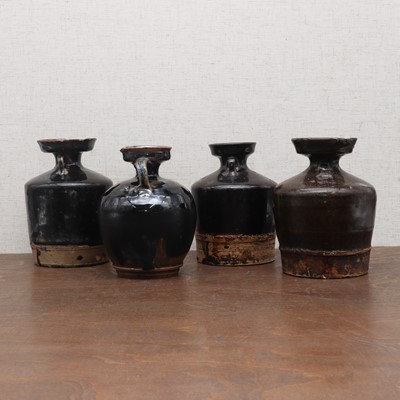 Lot 31 - A collection of four Chinese black-glazed jars