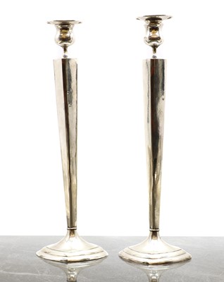 Lot 19 - A pair of Chinese silver plated candlesticks