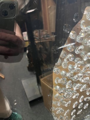 Lot 521 - A contemporary 'skull' wall mirror