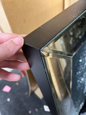Lot 521 - A contemporary 'skull' wall mirror