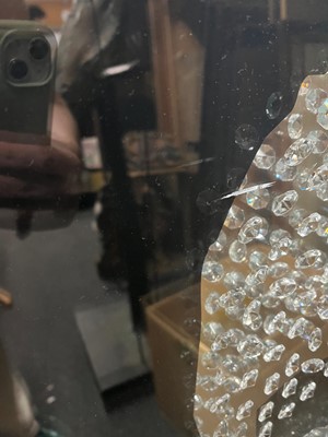 Lot 521 - A contemporary 'skull' wall mirror