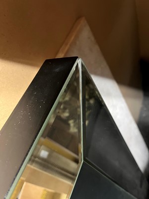 Lot 521 - A contemporary 'skull' wall mirror