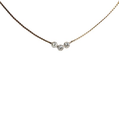 Lot 44 - A gold three stone diamond necklace