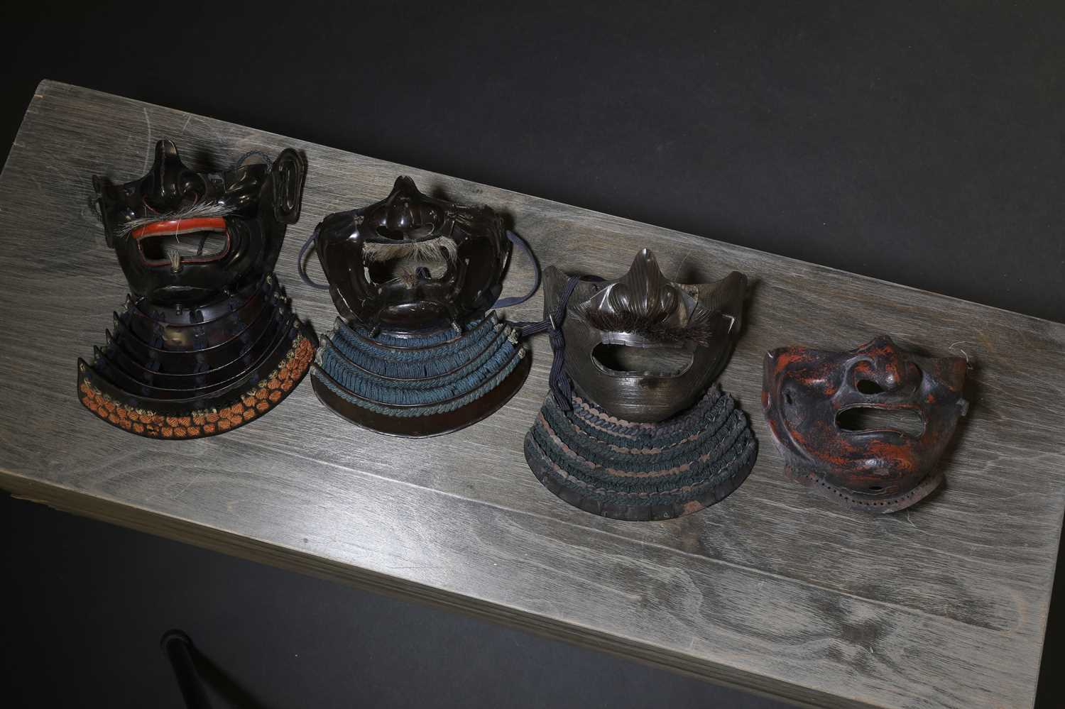 Lot 130 - A group of four Japanese menpo,