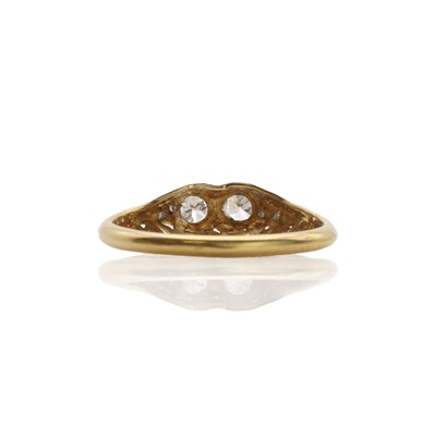 Lot 28 - An American Art Deco two colour gold, two stone diamond ring