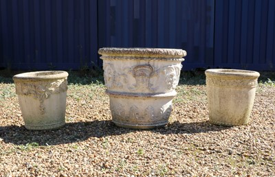 Lot 474 - A group of three composite stone garden urns