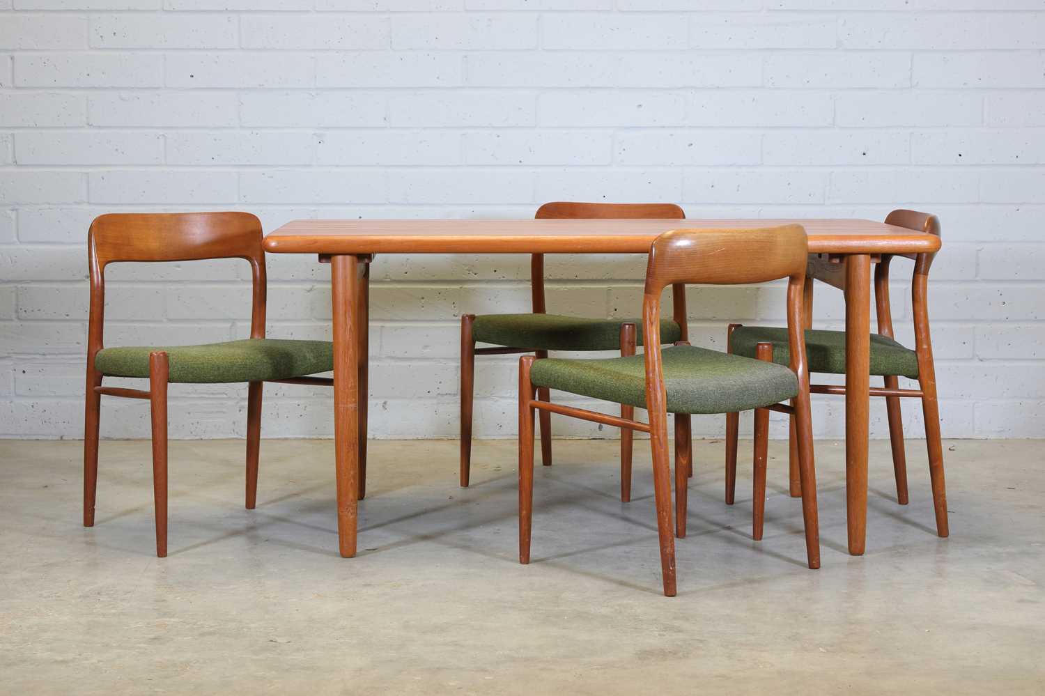 Lot 441 - A teak dining table and four chairs