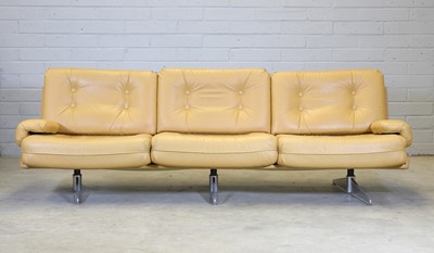 Lot 448 - A mustard yellow leather three-seater settee