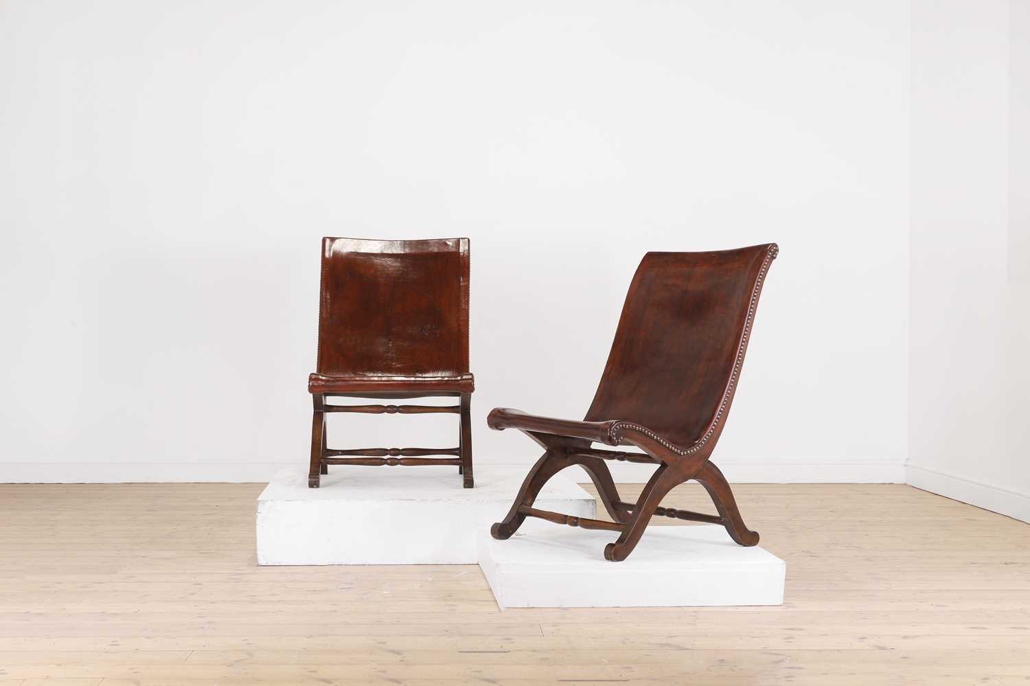 Lot 143 - A pair of leather low chairs by Pierre Lottier for Valenti