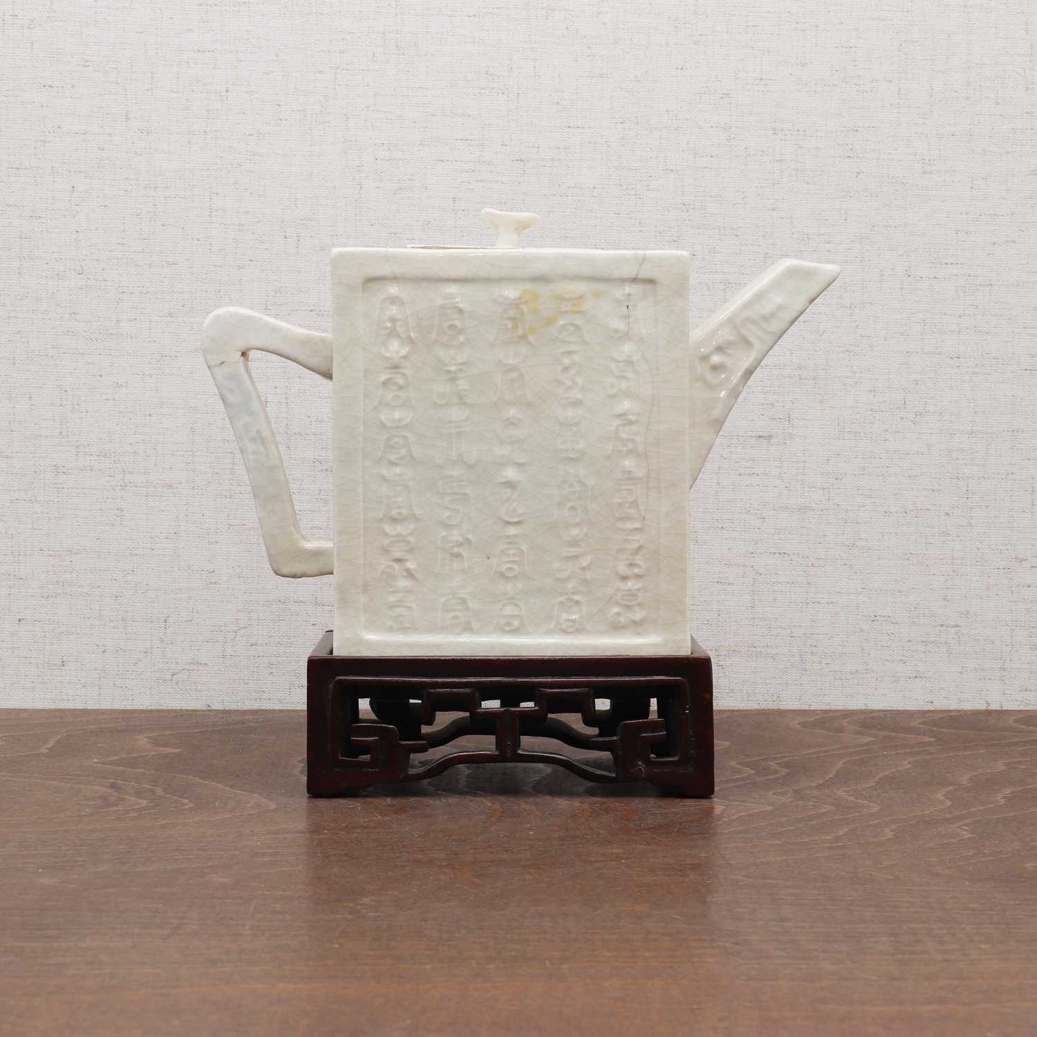 Lot 133 - A Chinese white-glazed teapot
