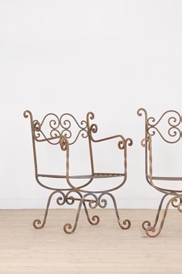 Lot 430 - A set of four wrought-iron garden chairs