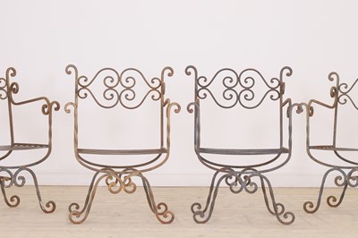 Lot 430 - A set of four wrought-iron garden chairs