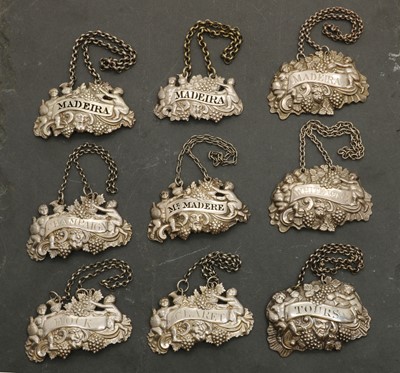 Lot 15 - A group of seven George III silver decanter labels