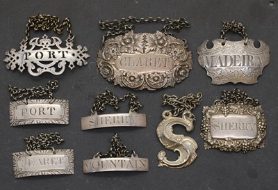Lot 19 - A group of nine silver decanter labels