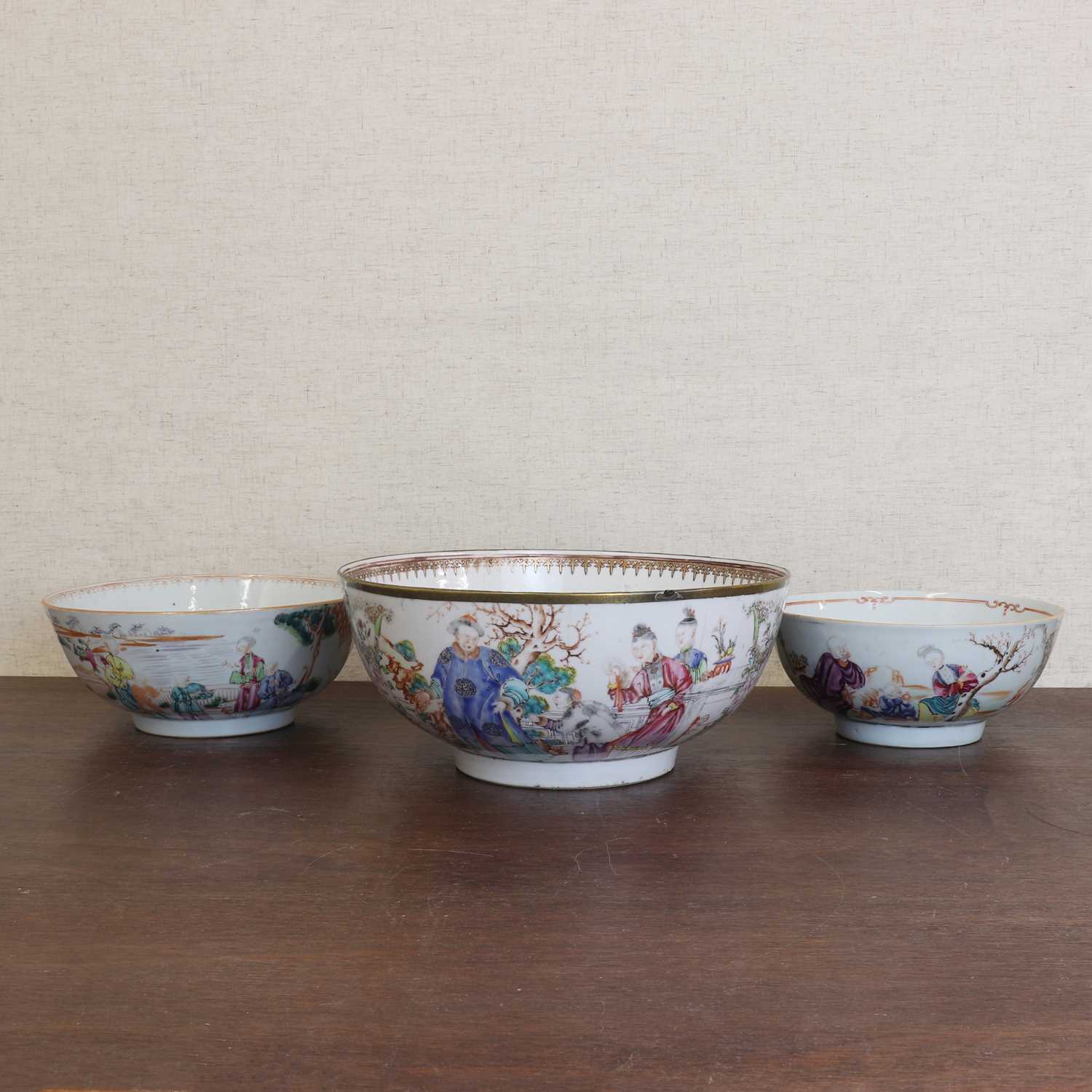 Lot 187 - Three Chinese export famille rose punch bowls