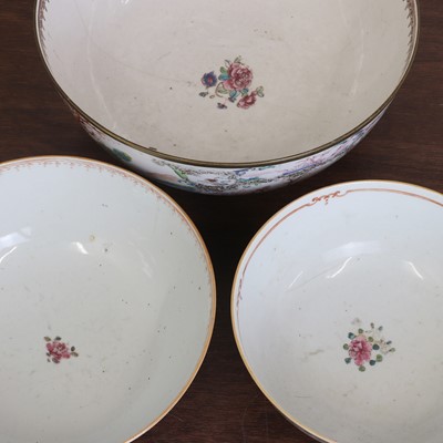 Lot 187 - Three Chinese export famille rose punch bowls