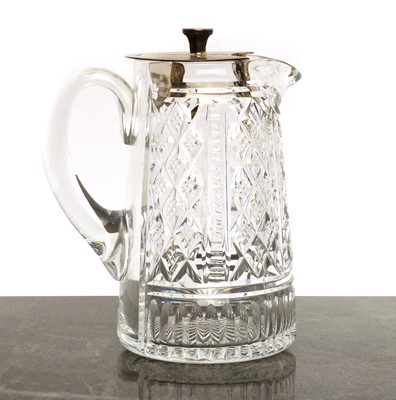 Lot 58 - A cut glass and silver-mounted water jug