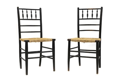 Lot 391 - A pair of ebonised side chairs