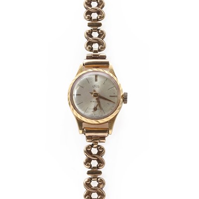 Lot 235 - An 18ct gold ladies' Uno mechanical bracelet watch