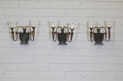 Lot 354 - A set of three French two-branch wall sconces