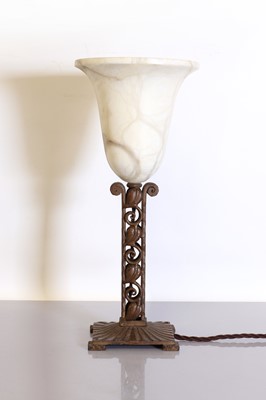 Lot 215 - An Art Deco alabaster and patinated table lamp
