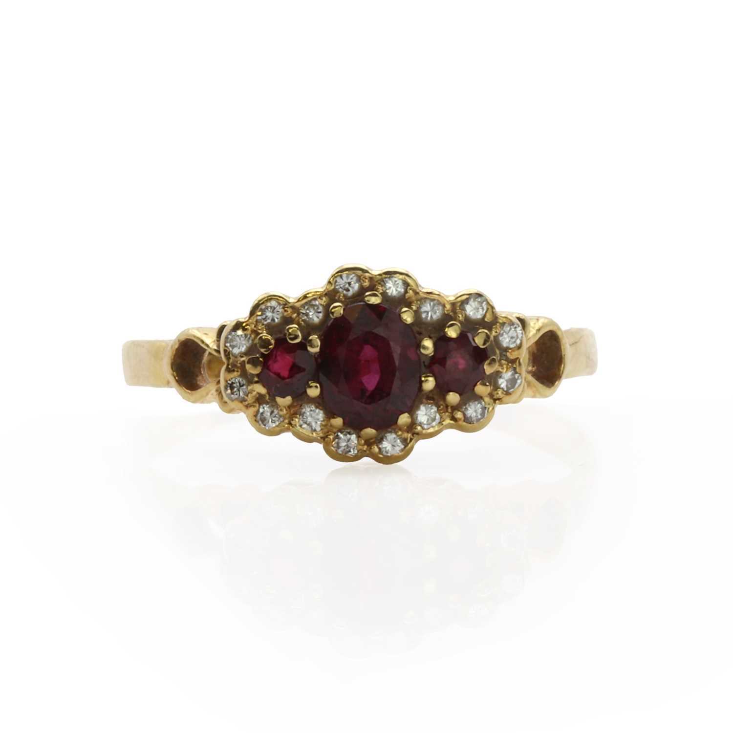 Lot 60 - An 18ct gold ruby and diamond cluster ring