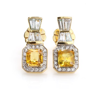Lot 63 - A pair of yellow sapphire cluster earrings