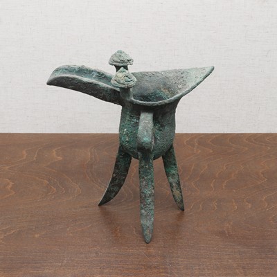 Lot 232 - A Chinese bronze 'jue' cup