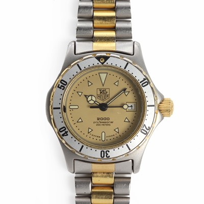 Lot 1461 - A ladies' stainless steel Tag Heuer '2000' bi-metal quartz bracelet watch