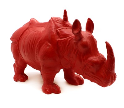 Lot 152 - A red leather mounted rhinoceros