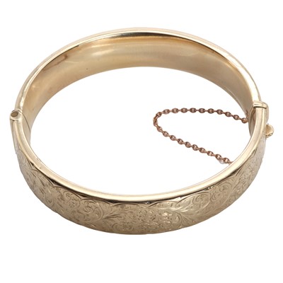 Lot 1196 - A 9ct gold hinged bangle