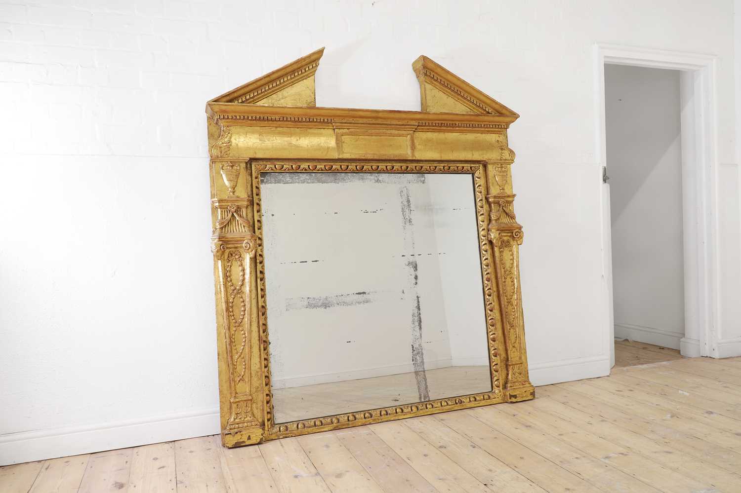 Lot 62 - A George II-style giltwood and gesso overmantel mirror