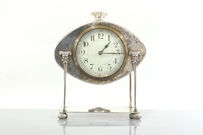 Lot 85 - An Arts and Crafts silver-plated desk clock