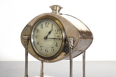 Lot 85 - An Arts and Crafts silver-plated desk clock