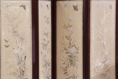 Lot 564 - An Edwardian four-fold screen with Japanese embroidery