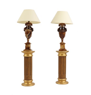Lot 175 - A pair of onyx table lamps